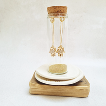 Load image into Gallery viewer, Gold Hamsa Oval Hoop Earrings in a Bottle
