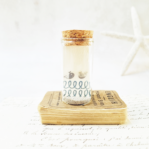 Adorable whale stud earrings in a bottle