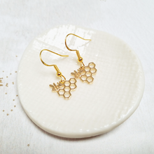 Load image into Gallery viewer, Gold Bee and Honeycomb Fish Hook Earrings in a Bottle
