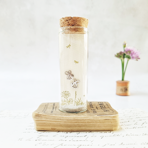 Classic bee on flora stud earrings in a bottle