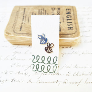 Bold bee stud earrings in a bottle