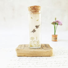 Load image into Gallery viewer, Classic bird on flower stem stud earrings in a bottle
