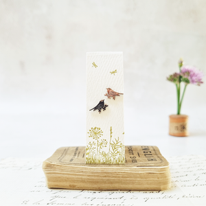 Classic bird on flower stem stud earrings in a bottle