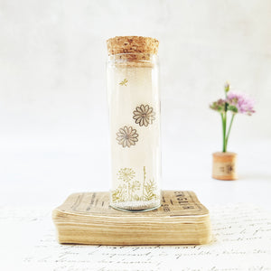 Classic daisy stud earrings in a bottle