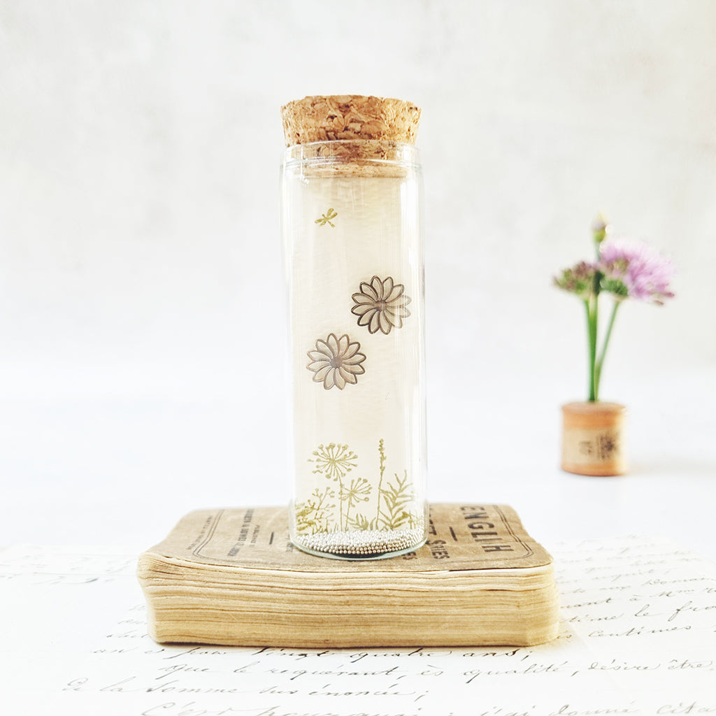 Classic daisy stud earrings in a bottle