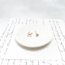 Load image into Gallery viewer, Gold Dog and  Paw Print Stud Earrings With a Hand-Drawn Illustration in a  Glass Dome.
