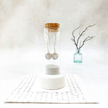Load image into Gallery viewer, Filigree Scallop Shell on a Oval Hoop in a Keepsake Bottle
