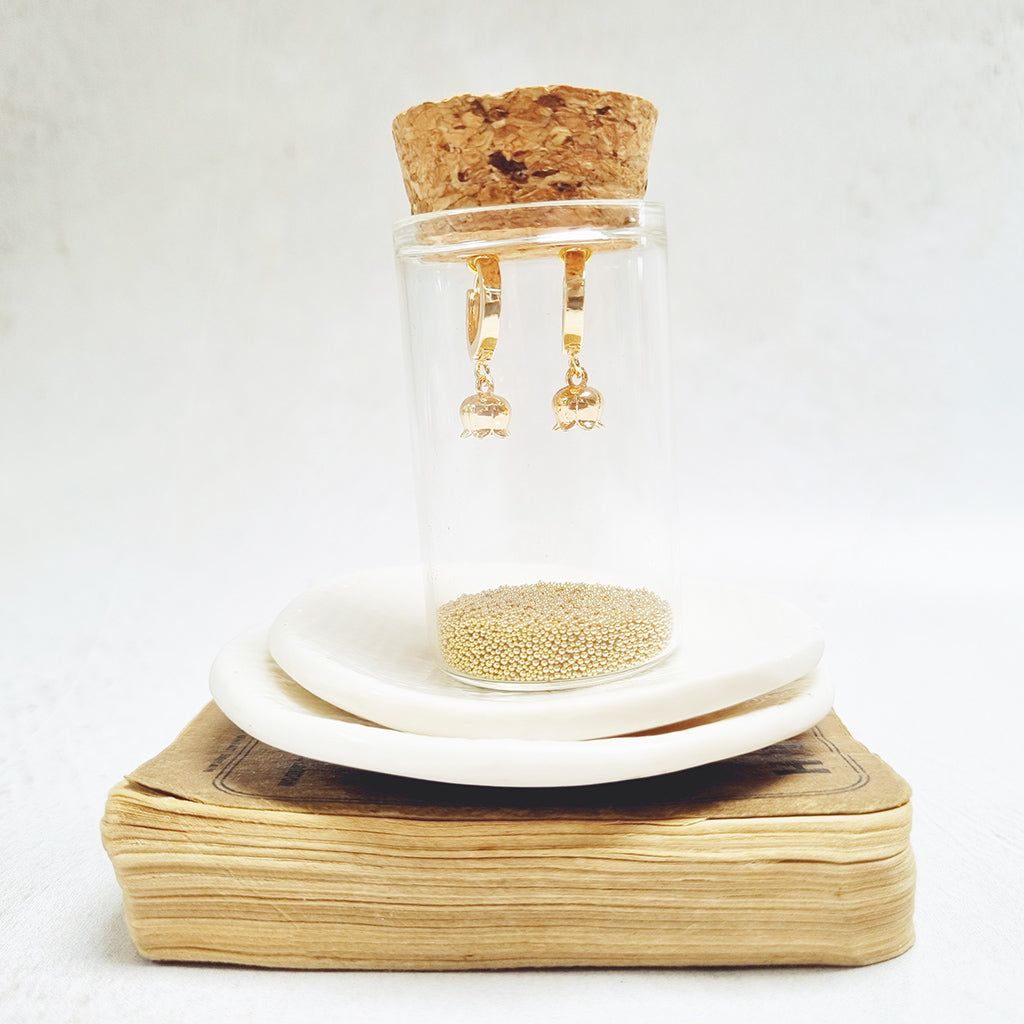 Gold Flower Huggie Earrings in a bottle - Zamsoe