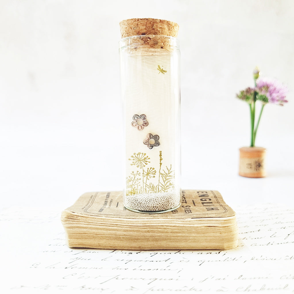 Classic flower stud earrings in a bottle