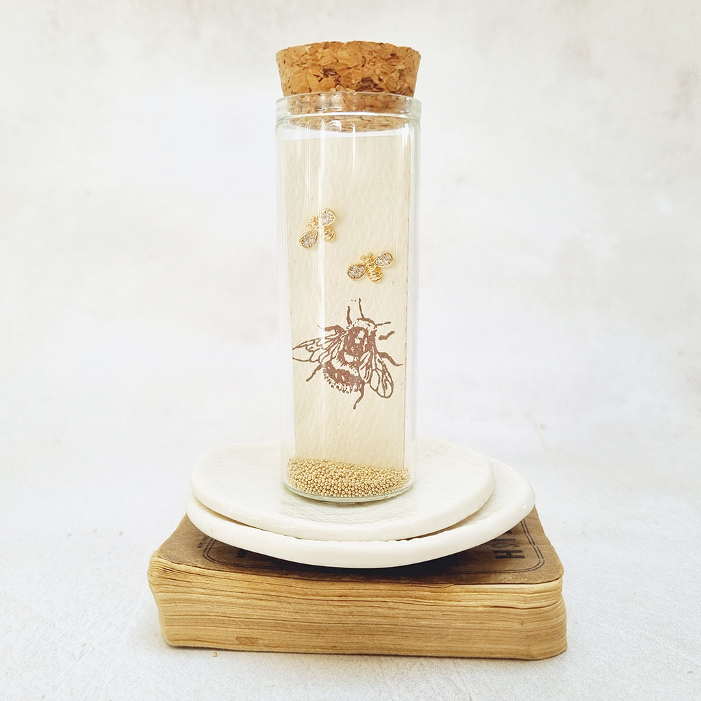 Gold Plated Bee Stud Earrings adorned with Cubic Zirconia Paves in a Bottle. - Zamsoe