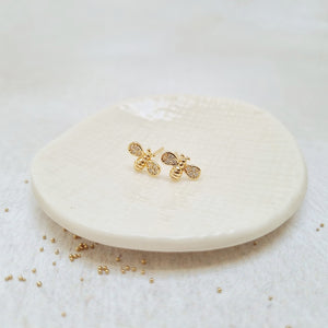 Gold Plated Bee Stud Earrings adorned with Cubic Zirconia Paves in a Bottle.