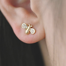 Load image into Gallery viewer, Gold Plated Bee Stud Earrings adorned with Cubic Zirconia Paves in a Bottle.
