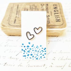 Adorable heart stud earrings in a bottle