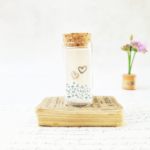 Adorable heart stud earrings in a bottle