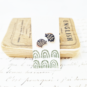 Charming hedgehog stud earrings in a bottle