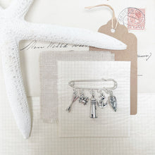 Load image into Gallery viewer, Rowing Boat and Lighthouse Charm Kilt Pin.
