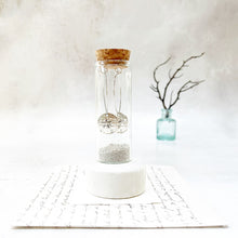 Load image into Gallery viewer, Sand Dollar Oval Hoops in a Keepsake Bottle
