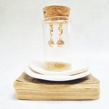 Load image into Gallery viewer, Gold Shell Huggie Earrings in a bottle
