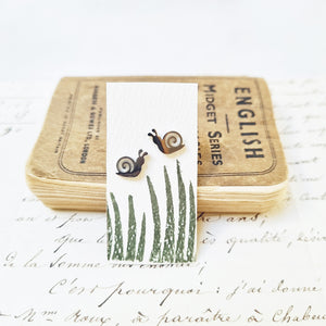 Gardeners snail earrings in a bottle