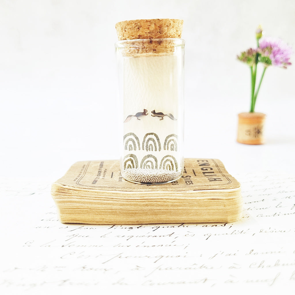 Sweet Squirrel stud earrings in a bottle