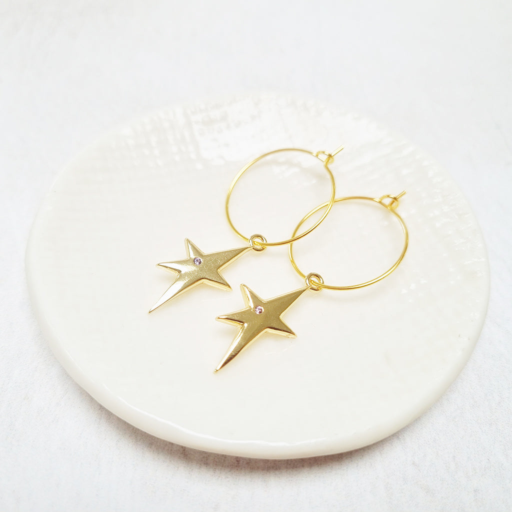 Gold Plated Abstract Star Pendant Hoop Earrings adorned with a Cubic Zirconia Paves Star.