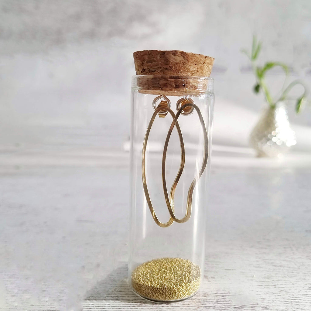 Abstract Oval Gold Earrings in a Bottle