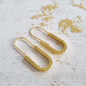 Oval Gold Earrings in a Bottle